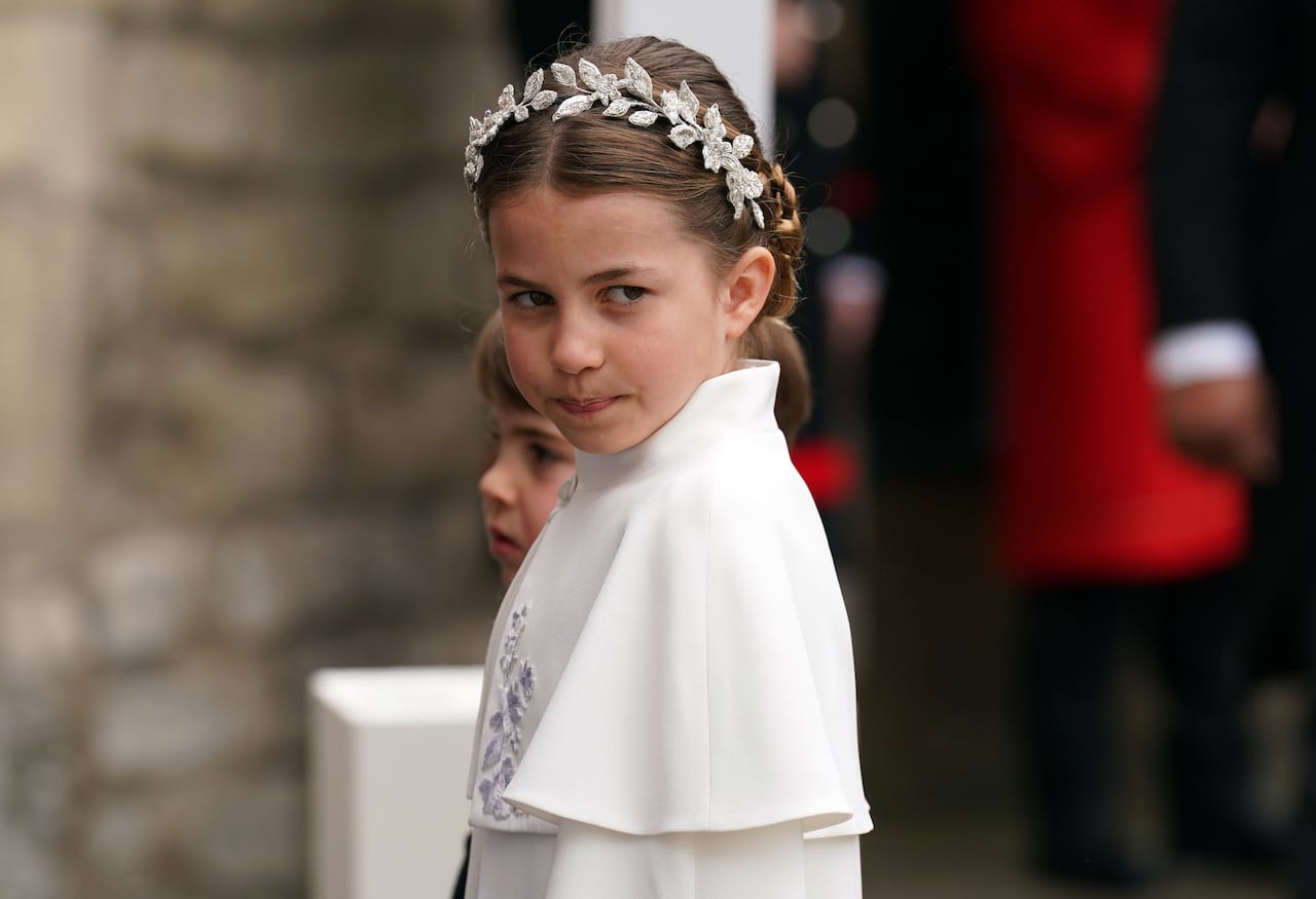 LONDON, ENGLAND - MAY 6: Princess Charlotte and Prince Louis arriving at Westminster Abbey, central London, ahead of the coronation ceremony of King Charles III and Queen Camilla on May 6, 2023 in London, England. The Coronation of Charles III and his wife, Camilla, as King and Queen of the United Kingdom of Great Britain and Northern Ireland, and the other Commonwealth realms takes place at Westminster Abbey today. Charles acceded to the throne on 8 September 2022, upon the death of his mother, Elizabeth II. (Photo by Andrew Milligan - WPA Pool/Getty Images)